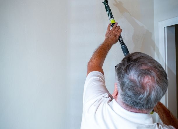 Painting the wall with a roller